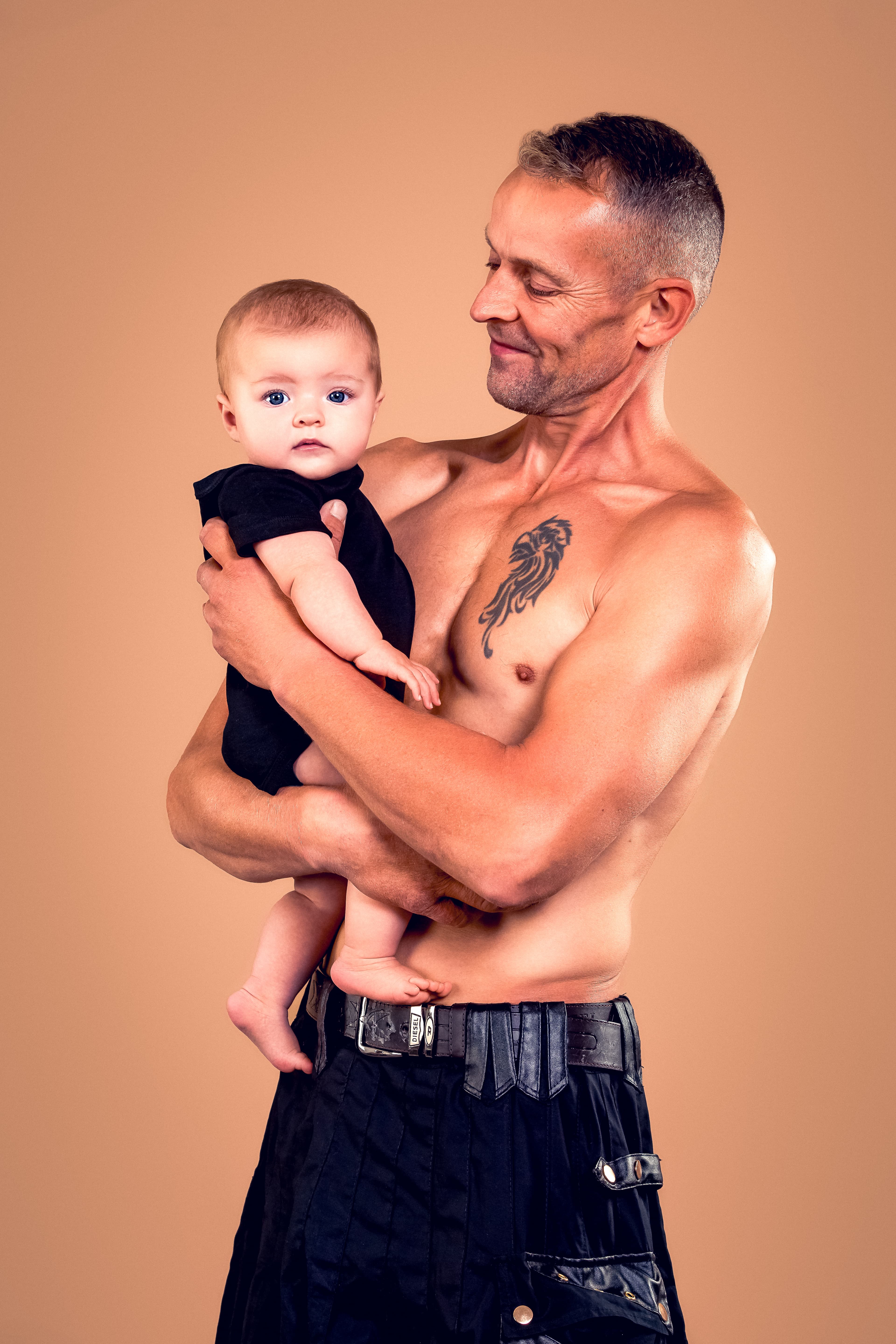 Father holding baby portrait